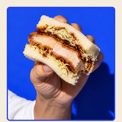 Bread Head post: a hand holding a sando