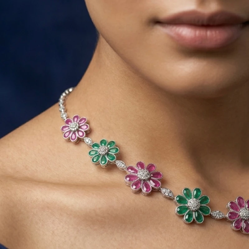 Closer portrait showing how the floral necklace sits across the model’s neckline.