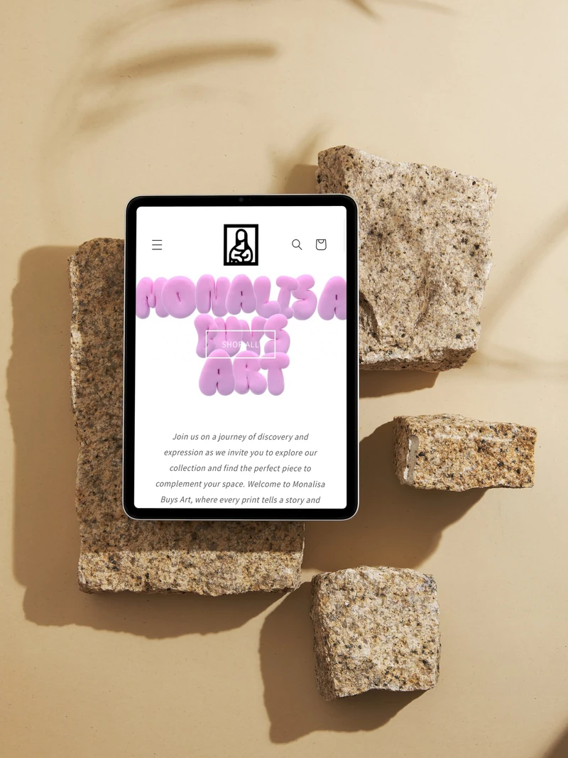 Tablet mockup showing the Monalisa Buys Art homepage, arranged on warm stone blocks.